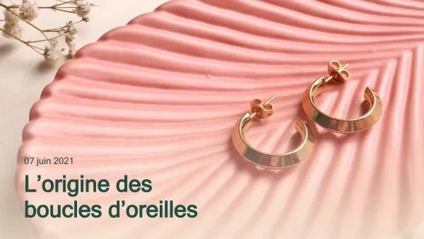 L'origine des boucles d'oreilles Immagine